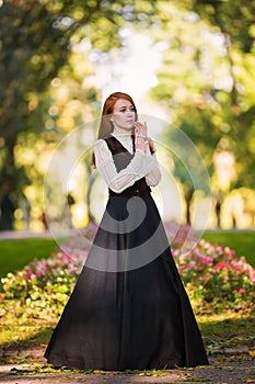 Red-haired woman in Victorian outfit