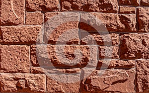 Red hand-made brick wall background. Abstract pattern with inequalities