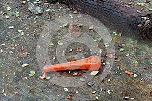 A red hand shutting off lever controls supply water valve, under the floor.