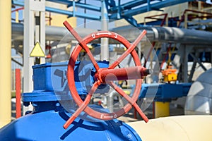 Red handle gate valve with steel pipe on gas compressor station