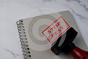 Red Handle Rubber Stamper and Stop Pest text isolated on White Background