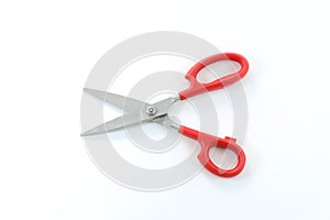Red handle scissors in the open position