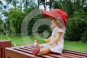 Red hat and adorable girl doll