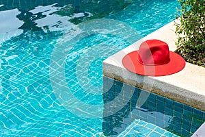 Red hat on the Blue water swimming pool