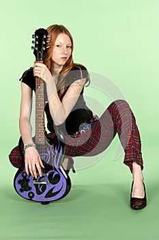 Red Head Rock and Roll Guitar Player Squating