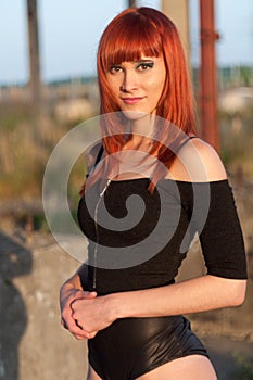 Red head streaptease girl urban concrete destruct landscape