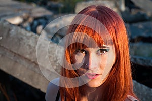 Red head streaptease girl urban concrete destruct landscape