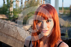 Red head streaptease girl urban concrete destruct landscape