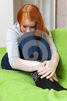 Red-headed lonely sad teenager