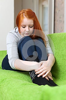 Red-headed lonely sad teenager