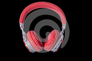 Red headphone and cable isolated on background..Headphones.Red headphone.Technology