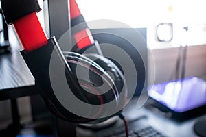 Red headphone in home studio on computer desk