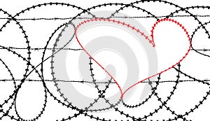 Red heart in barbwire fence