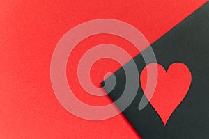 red valentines heart on black red background photo