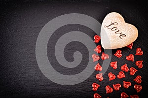 Red Heart On Black Stone Background. Love and Valentines Day Concept.