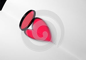 Red heart on blank book