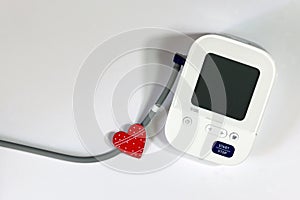 Red Heart and Blood Pressure Monitor Heart Disease Diagnostic Concept.