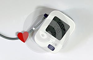 Red Heart and Blood Pressure Monitor Heart Disease Diagnostic Concept.