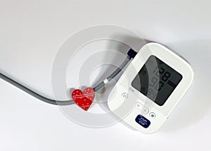 Red Heart and Blood Pressure Monitor Heart Disease Diagnostic Concept
