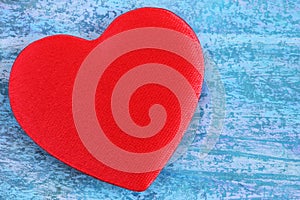 Red heart on a blue abstract background