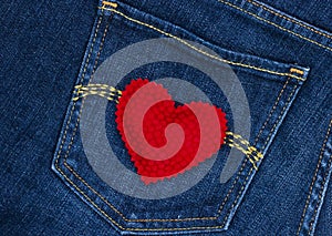 Red heart on blue denim jean pocket