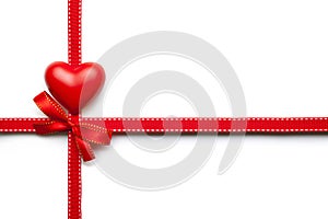 Red heart, bow and ribbon on white background