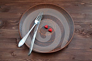 Red heart for celebration decoration design. Valentine concept. Heart gift on plate on wooden background