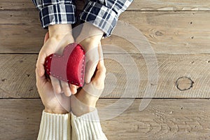 Red heart in hands