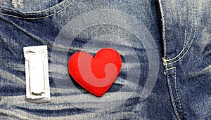 Red heart and condom with blue jean