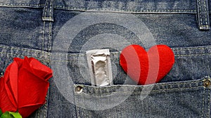 Red heart and condom with blue jean