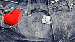 Red heart and condom with blue jean