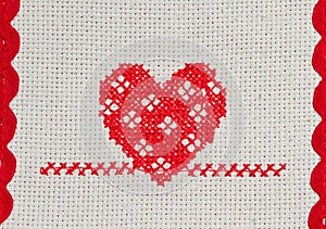 Red heart embroidered in cross stitch