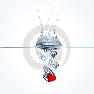 Red heart falling into water