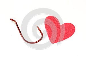 Red heart with fishing hook photo