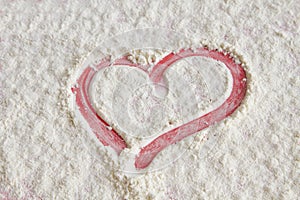 Red heart on flour background