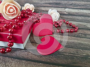 Red heart, gift box beads wooden craft dating february background decorative