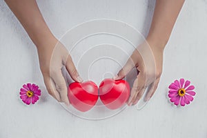Red heart on girl hand. concept for valentine`s day
