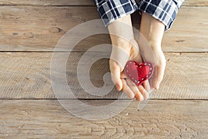 Red heart in hands