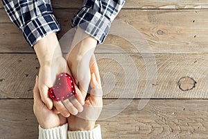 Red heart in hands