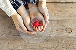 Red heart in hands