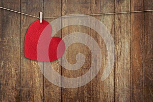 Red heart hanging on Wood Background and Texture vertical, Vintage toned