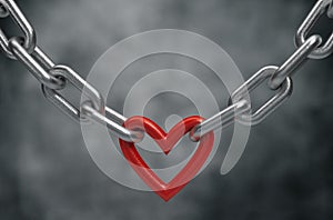 Red heart held by a steel chain background