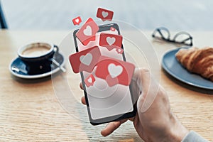 Red heart Like symbols on mobile phone. Social media concept. 3d rendering.