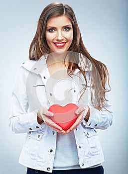 Red heart. Love symbol. Portrait of beautiful woman hold Valent