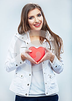 Red heart. Love symbol. Portrait of beautiful woman hold Valent