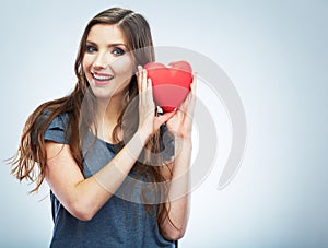 Red heart. Love symbol. Portrait of beautiful woman hold Valent