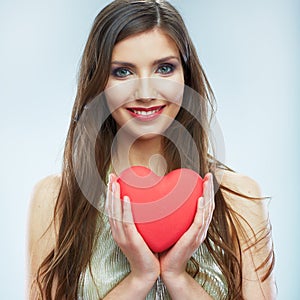 Red heart. Love symbol. Portrait of beautiful woman hold Valent