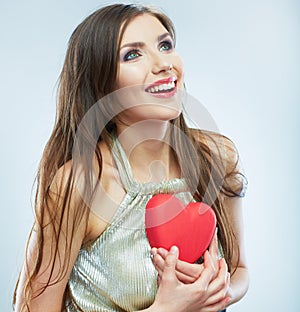 Red heart. Love symbol. Portrait of beautiful woman hold Valent