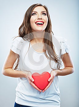 Red heart. Love symbol. Portrait of beautiful woman hold Valent