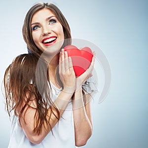 Red heart. Love symbol. Portrait of beautiful woman hold Valent